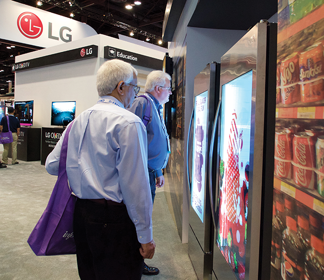 Attendees studied the image quality of LG's new M+ transparent LED display.