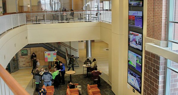 The Alumni Tower located in the main lobby of the DeNaples Student Center features five 70-inch displays. A touchpanel located at the bottom allows students to choose which information is displayed and heard through the sound system.