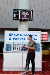 A convention attendee takes a break in front of one of 17 single monitors at the Georgia World Congress Center in Atlanta.