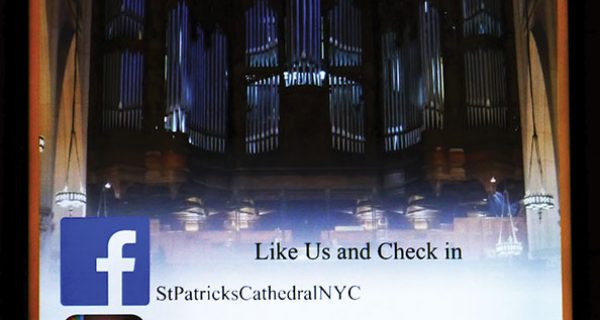 Signage at St. Patrick’s Cathedral in New York City links viewers to additional information.