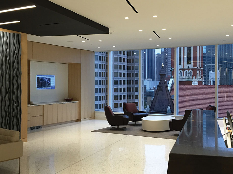 A flatpanel LCD TV encased in glass adds design sensibility in relation to the adjacent windows.