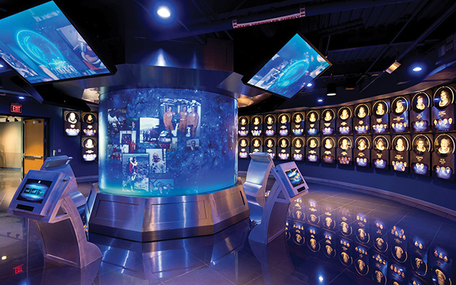 The Hall of Fame’s centerpiece is a 10-foot-diameter cylindrical rear-screen projection surface featuring five 8500 lumen projectors that are used to help overcome high ambient light from the LED lighting illuminating the astronaut plaques.