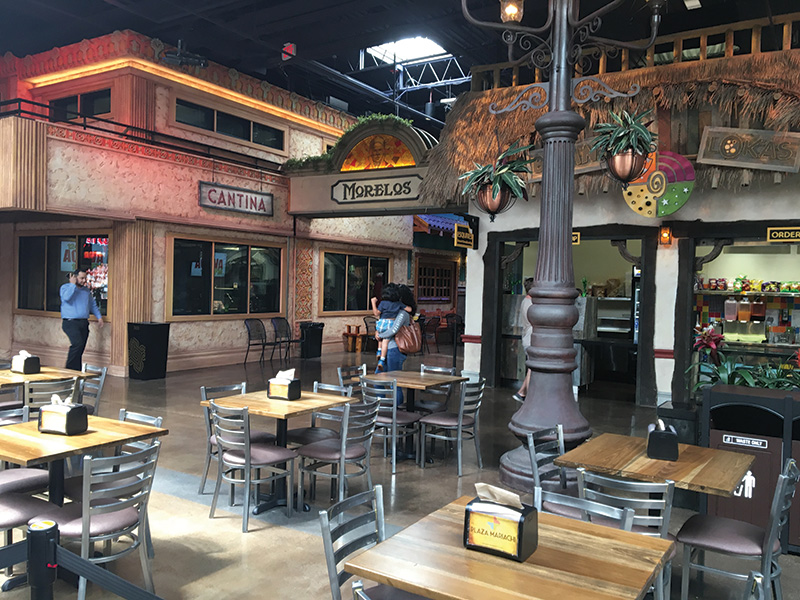 The restaurant windows in the spacious food court act as diffusion for the sound in the area.