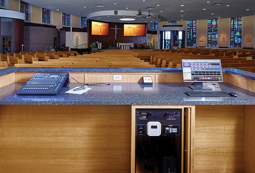 The sanctuary lacked a front-of-house mixing location, so Lifeline designed a custom standup mixing desk and created an FOH position by removing a pew from the back row of seating.