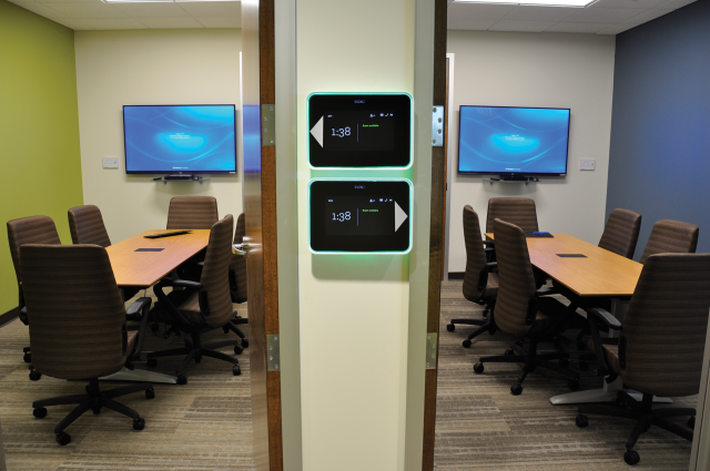 Room Schedulers are mounted outside two of the conference rooms.
