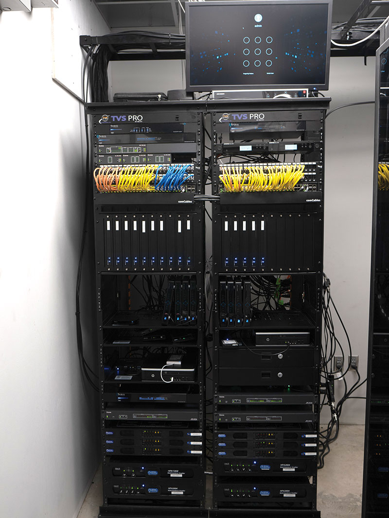 Two equipment racks keep All-Star Bowling’s AV and control-system gear safe in a central closet.