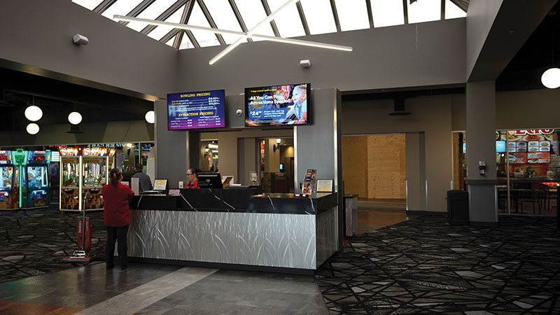 Digital-signage screens greet guests in the lobby of All-Star Bowling.