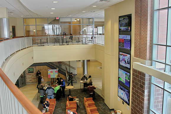 The Alumni Tower located in the main lobby of the DeNaples Student Center features five 70-inch displays. A touchpanel located at the bottom allows students to choose which information is displayed and heard through the sound system.