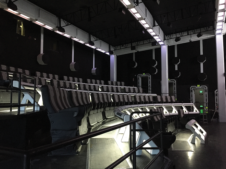 The completed auditorium. Visible are the 70 far-field speakers along the walls and the ceiling truss, the motion effect seats and the Comhear MyBeam near-field audio speakers, located in the bars in front of each seat.