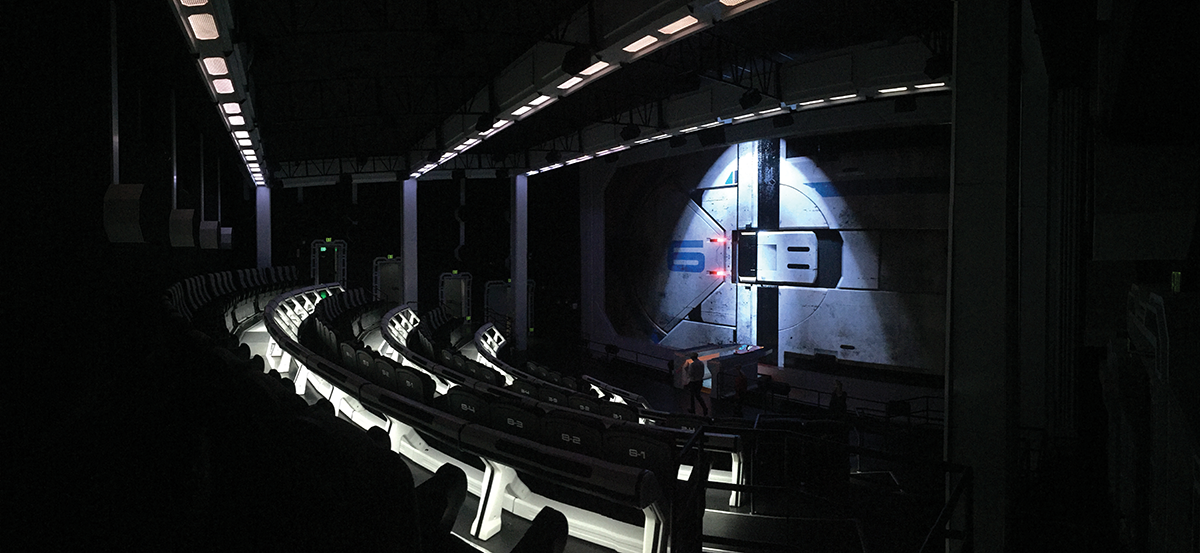 The hanger door on the screen is projected by the LEDs. This provides for a seamless transition from the load screen, pictured, to the attraction’s action-packed film.