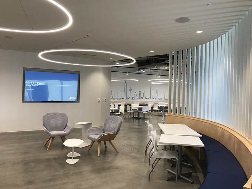 A 90-inch LCD panel for Café presentations and playback of digital media or TV. Four ceiling speakers over the seating area provide voice lift and background music.