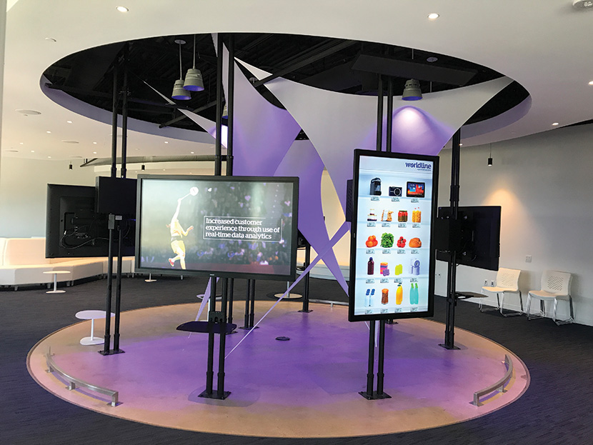 A custom-built mount enables the digital signage displays in each Vignette to rotate from landscape to portrait mode.