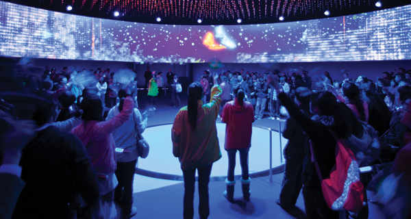 Visitors wave in unison, activating the LED façade and becoming experientially linked to the building, inside the Dream Cube.
