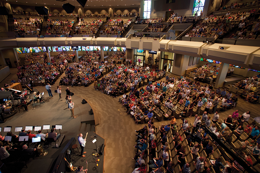 Each of the five sections of main floor seating is covered by a speaker. Extensive acoustic treatment, some of which is visible along the front of the balcony, was used to make the sanctuary more suitable for live sound.