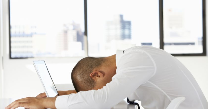 AVIXA POV, Man with head on computer