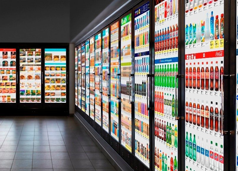 convenience store with digital displays on refrigerator doors