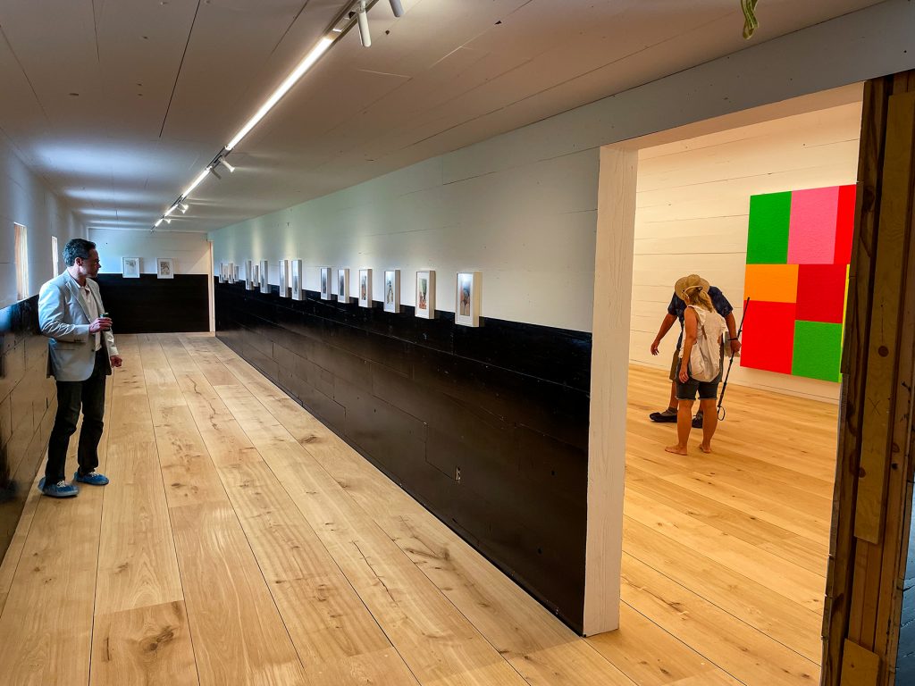 man viewing art in corridor at the ranch in montauk