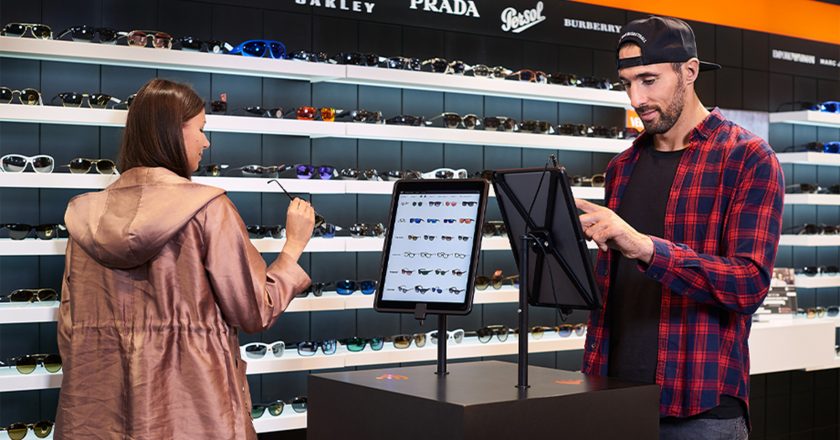 two people using ipads integrated into a retail store