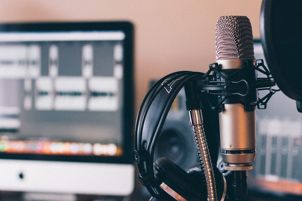 condenser microphone and headphones in a music studio