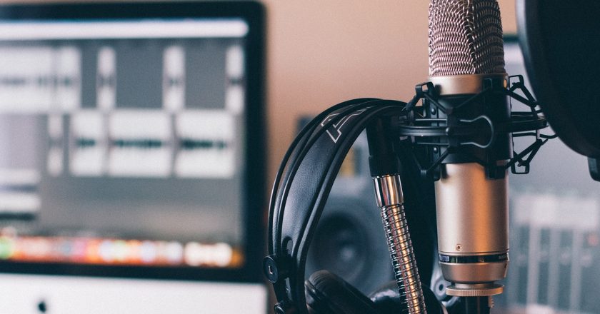 condenser microphone and headphones in a music studio